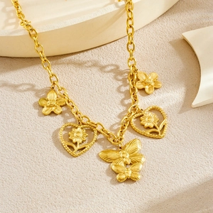 Gold plated stainless steel necklace with hollow flower and butterfly pendants on stones