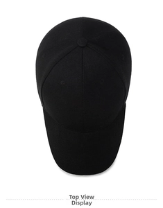 Top view of a minimalist black cotton twill baseball cap showing panel stitching and button