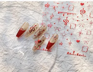 Adesivi per nail art 3D rossi a rilievo con fiocchi e serpenti su unghie finte