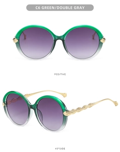 Detail of green gradient oversized sunglasses featuring golden leaf woven textured temples