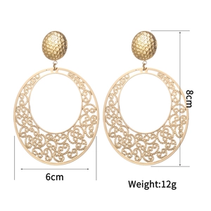 Detail of gold hollow carved round earrings showing dimensions of 8cm by 6cm and 12g weight