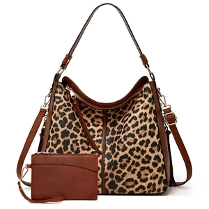 2-piece leopard print tote bag set with brown leather straps and matching small pouch