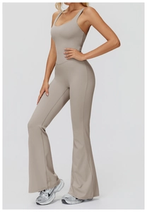 Detail view of khaki flare leg jumpsuit with thin straps and a flattering U-neckline