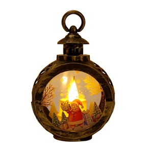 Vintage bronze Christmas lantern with LED flame, Santa Claus and festive holiday scene