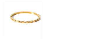 Detail showing 4mm wide 18k gold plated stainless steel bangle with white cubic zirconia