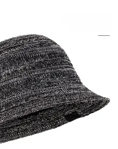 Close-up of breathable knitted bucket hat showing wide brim and textured cross-weave detail