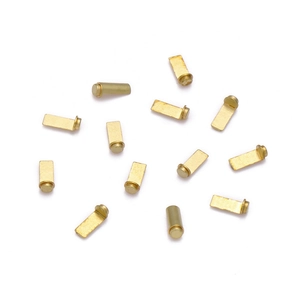 Macro shot of precision brass charging contact pins for wireless Bluetooth earbuds