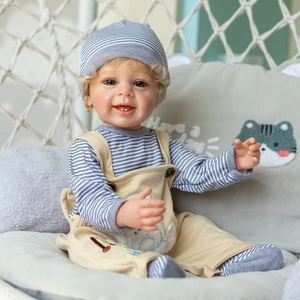 Lifelike 55cm boy reborn doll Yannik with blond hair and blue eyes in striped outfit