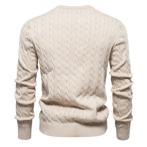Detailed back view of beige cable-knit sweater showing premium texture and pattern
