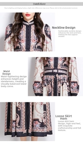 Detail view of Baroque floral print on the stand collar, belted waist, and hem of the dress