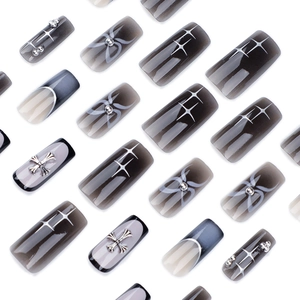 Square French press-on nails with black gradient, silver crosses and star patterns