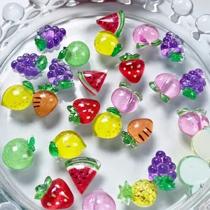 Assorted colorful resin fruit nail art charms including strawberry and grape patterns