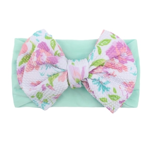 Floral print baby nylon headband with large bow in soft mint green waffle fabric