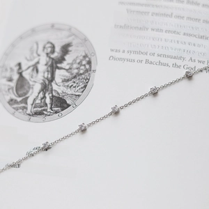 Minimalist silver titanium steel bracelet with five sparkling round cubic zirconia stones