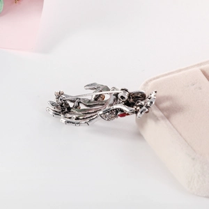 Retro punk skeleton hand brooch in antique silver alloy with red rhinestone accents