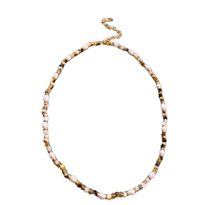 French vintage freshwater pearl necklace with gold and brown faceted beads on white base