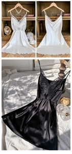 Détails d'une nuisette en satin avec broderie papillon en dentelle et texture soyeuse