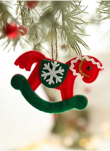 Detailed view of red and green felt rocking horse ornament with snowflake embroidery