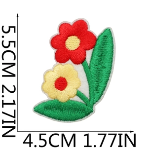Close-up of floral embroidery patch with red and yellow flowers and dimensions