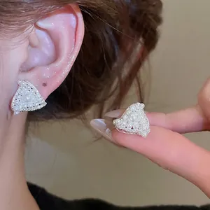 Elegant geometric triangle stud earrings with inlaid pearls and silver needle setting