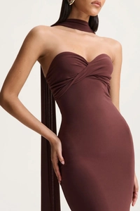 Detail of chocolate brown bodycon dress featuring cross-twist bodice and matching neck scarf