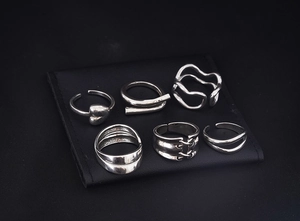 Macro detail of S925 hallmark on a set of six vintage silver adjustable open rings