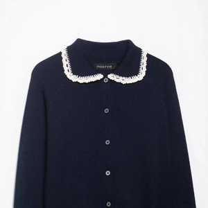 Navy knit cardigan with contrast white lace collar and button-front design for women