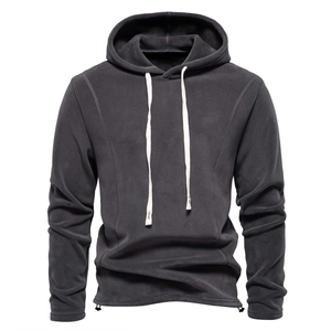 Detailed view of dark grey polar fleece hoodie with white flat drawstrings and ribbed cuffs
