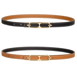 Minimalist reversible slim waist belt in black and brown leather with golden metal buckle