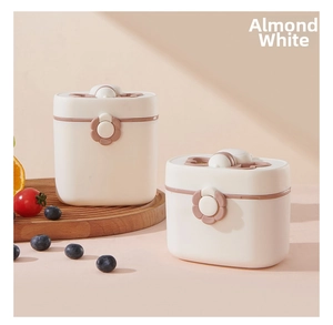 Close-up of portable baby milk powder containers in almond white with pink sealing clips