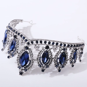 Detailed close-up of Baroque silver bridal crown with deep blue crystals and rhinestones