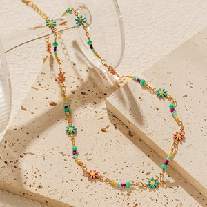 Bohemian beaded necklace with colorful flower pendants and gold chain for women