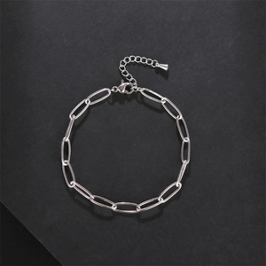 Top view of silver stainless steel oval link chain bracelet with lobster clasp and extension