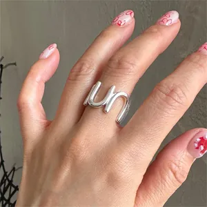 Detailed close-up of S925 sterling silver U-shaped ring with minimalist un-letter design