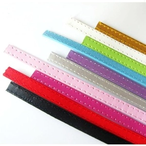 Close-up of 8mm faux leather strips with stitching detail in various vibrant colors