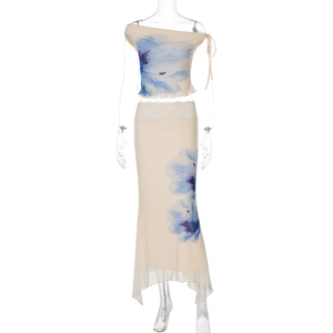 Close-up of floral print two-piece set featuring off-shoulder top and irregular long skirt