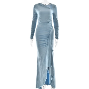 Close-up of blue slim fit dress featuring shimmering fabric and ruched pleated textures