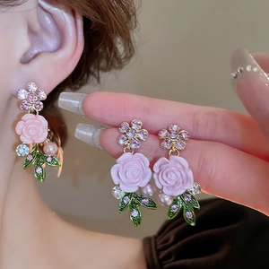 Elegant gold earrings with pink roses, purple crystals, green leaves and pearls