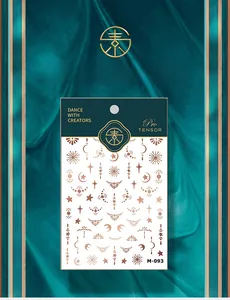 Macro detail of M-093 gold bohemian nail stickers with stars and moon celestial patterns