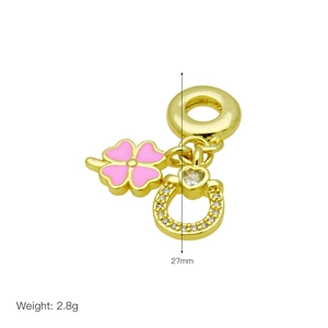 Detail view of gold charm with pink clover and horseshoe including 27mm size marking