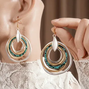 Ethnic layered circular drop earrings with silver, gold and turquoise marble rings