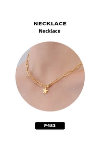 Detail of 18K gold plated titanium steel necklace with star pendant and paperclip chain