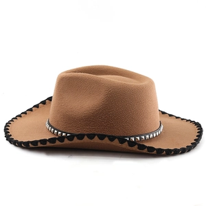 Detail of dark brown wool fedora with silver stud leather band and woven brim edge