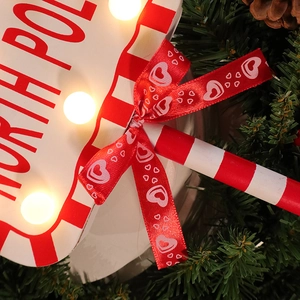 Christmas North Pole LED wooden signpost decoration with warm lights and festive red ribbon bow
