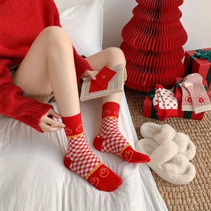 Festive red combed cotton crew socks with seamless toe and plaid heart patterns