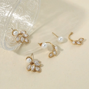 Elegant gold leaf earrings with white pearls and sparkling marquise zircons