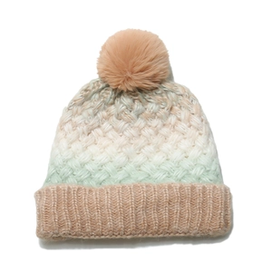 Detailed view of the chunky knit texture and soft tri-color gradient of the warm winter hat