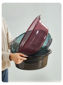 Detail showing translucent plastic washbasins with ergonomic double-ear handles