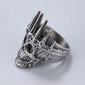 Detailed side view of punk silver skull crown ring with vintage stainless steel finish