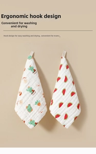 Close-up of two soft cotton gauze baby towels featuring cactus and watermelon prints with hooks
